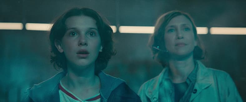 Madison (Millie Bobby Brown) and mom (Vera Farmiga) witness Mothra's rebirth in Godzilla: King of