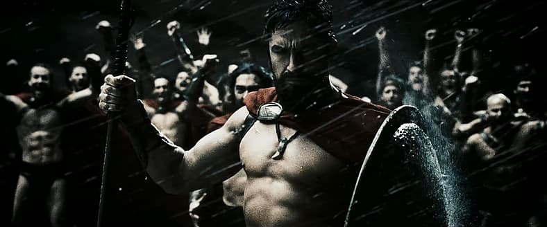 King Leonidas (Gerard Butler) watches Persian vessels sink in 300 (2006), Legendary Pictures
