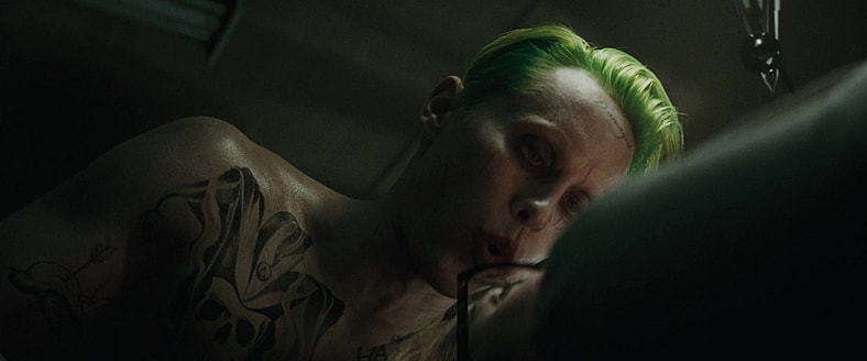 Joker (Jared Leto) brings Harley Quinn (Margot Robbie) to his side in Suicide Squad (2016), Warner Bros. Pictures