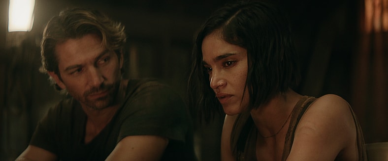Rebel Moon — Part Two: The Scargiver. (L-R) Michiel Huisman as Gunnar and Sofia Boutella as Kora in Rebel Moon — Part Two: The Scargiver. Cr. Netflix © 2024.