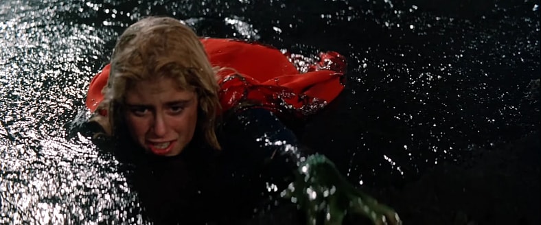 Mud wrestling is not Kara's (Helen Slater) forte in Supergirl (1984), Warner Bros. Pictures