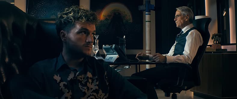 Josh Hutcherson as Derek Danforth and Jeremy Irons as Wallace Westwyld in The Beekeeper (2024)