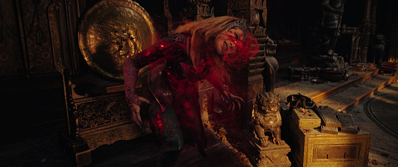 The Scarlet Witch (Elizabeth Olsen) goes full Sam Raimi as she emerges from a mirror in Doctor Strange in the Multiverse of Madness (2022), Marvel Entertainment