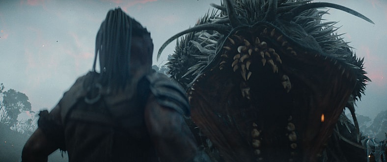 Dek (Dimitrius Schuster-Koloamatangi) faces a threat in Predator: Badlands (2025), 20th Century Studios