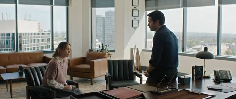 Bradley (Dylan O'Brien) isn't gentle while breaking the bad news to Linda (Rachel McAdams), in Send Help (2026) 20th Century Studios 