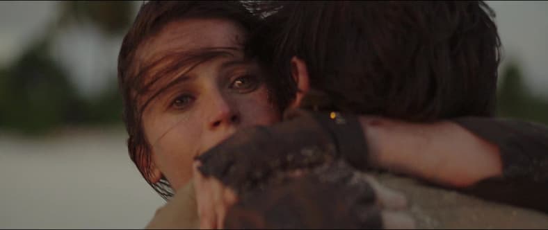 Jyn and Andor embrace as Scarif is obliterated in Rogue One: A Star Wars Story (2016), Disney
