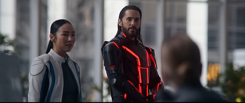 Greta Lee and Jared Leto check in with security in Tron: Ares (2025), Walt Disney Pictures