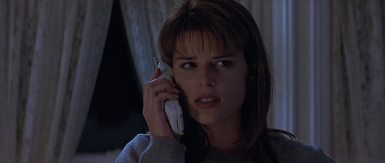 Sidney Prescott (Neve Campbell) has her first interaction with Ghostface in Scream (1996), Paramount Pictures