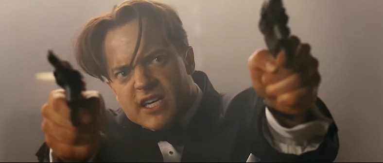 Brendan Fraser is cocked, locked, and loaded for another round in The Mummy: Tomb of the Dragon Emperor (2008), Universal Pictures