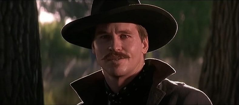 Doc Holliday (Val Kilmer) is about to show Johnny Ringo (an offscreen Michael Biehn) what it means to "play for blood" in Tombstone (1993) Buena Vista Pictures/Cinergi
