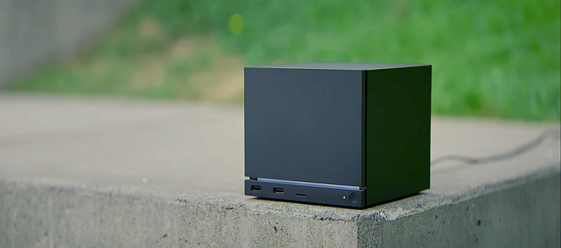 A Steam Machine on concrete slab near grass
