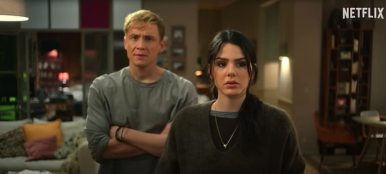 Tim (Matthias Schweighöfer) and Olivia (Ruby O. Fee) try to figure out the patterns on the wall in Brick (2025), Nocturna Productions