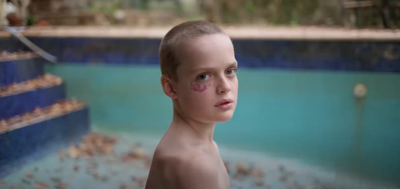 Oliver (Jonah Wren Philips) is seated in a pool in Bring Her Back (2025), Causeway Films