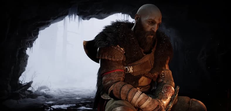 Kratos warms himself by the fire in God of War: Ragnarök (2022), Sony Santa Monica Studios