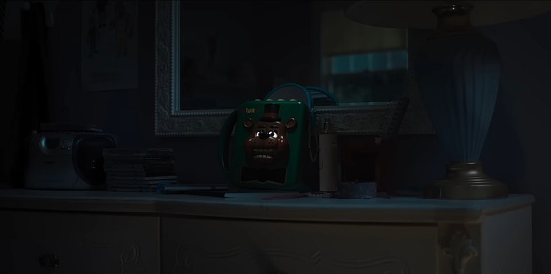 The evil speaks through static and brokenness, but batteries aren't included, in Five Nights At Freddy's 2 (2025), Universal Pictures