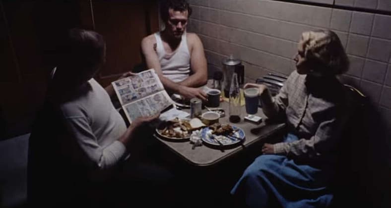Criminals (Tom Towles and Michael Rooker) share moment with family (Tracey Arnold) in Henry