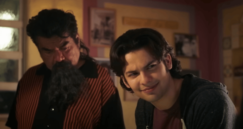 George Lopez as Uncle Rudy and Xolo Maridueña as Jaime Reyes in Blue Beetle (2023), DC Studios