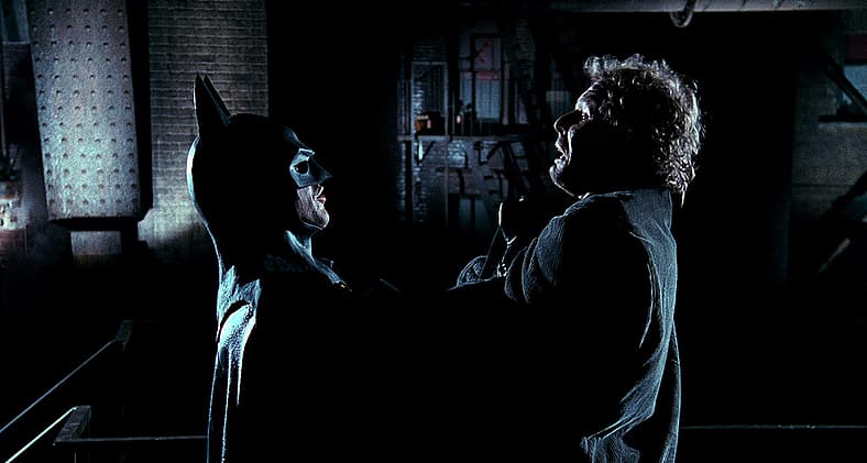 Batman threatens a petty criminal at the beginning of 'Batman' (1989), Warner Bros.