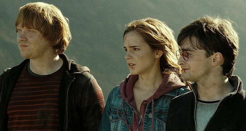 Ron Weasley (Rubert Gint), Hermoine Granger (Emma Watson), and Harry Potter (Daniel Radcliffe) look out to the future in the final scene of Harry Potter and the Deathly Hallows - Part 2 (2010), Warner Bros. Pictures