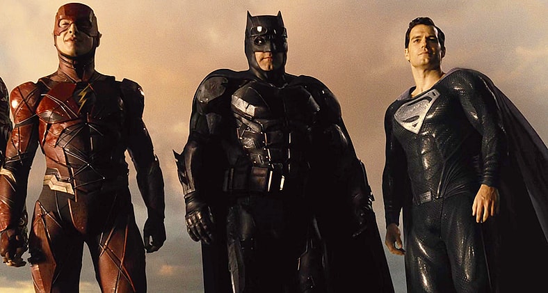 The Flash (Ezra Miller), Batman (Ben Affleck) and Superman (Henry Cavill) stand triumphant over Darkseid (Ray Porter) in Zack Snyder's Justice League (2021), Warner Bros. Pictures