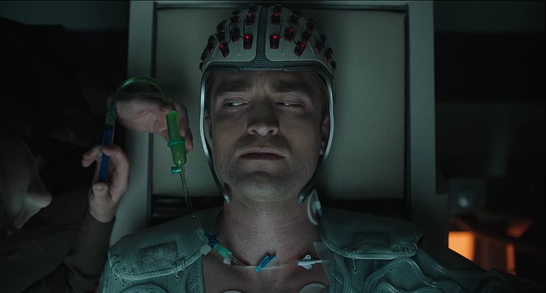 Robert Pattinson wears his special helmet for his shots in Mickey 17 (2025), Warner Bros. Pictures