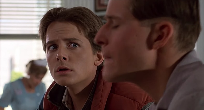 Marty (Michael J. Fox) can't believe his dad (Crispin Glover) is a wimp in Back to the Future (1985), Universal Pictures