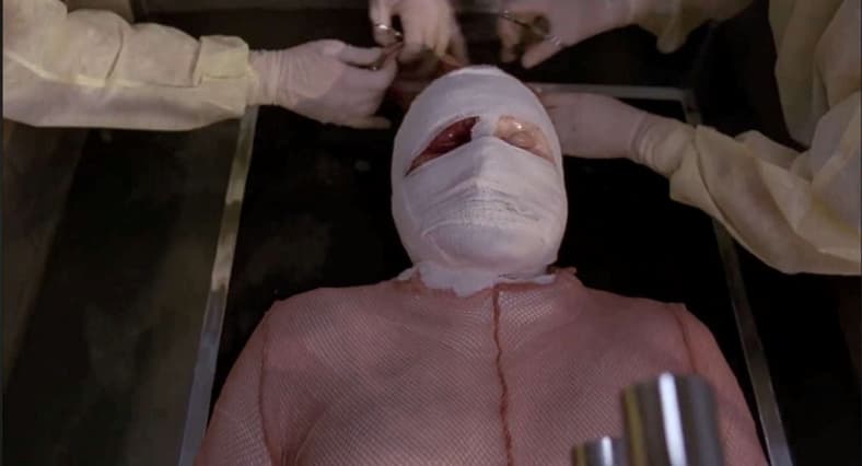 Dr. Peyton Westlake (Liam Neeson) outdoes Richard Pryor's fire challenge in Darkman (1990), Universal Pictures 