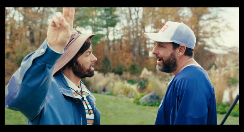 Happy (Adam Sandler) gets heckled by Donald Jr. (Eminem) in Happy Gilmore 2 (2025), Netflix
