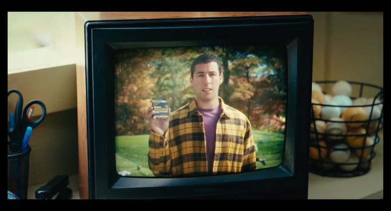 Happy (Adam Sandler) promotes Trojan condoms in Happy Gilmore 2 (2025), Netflix