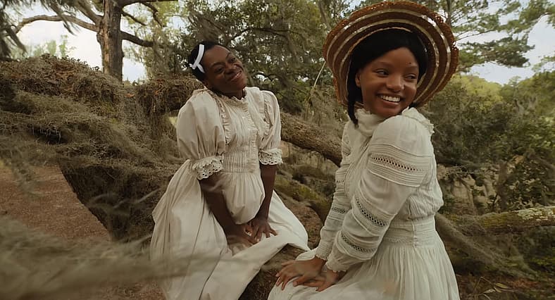 Phylicia Pearl Mpasi as Young Celie and Halle Bailey as Young Nettie in The Color Purple (2023)