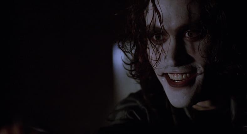 Eric Draven (Brandon Lee) tells Funboy (Michael Masse) to say his prayers in The Crow (1994)