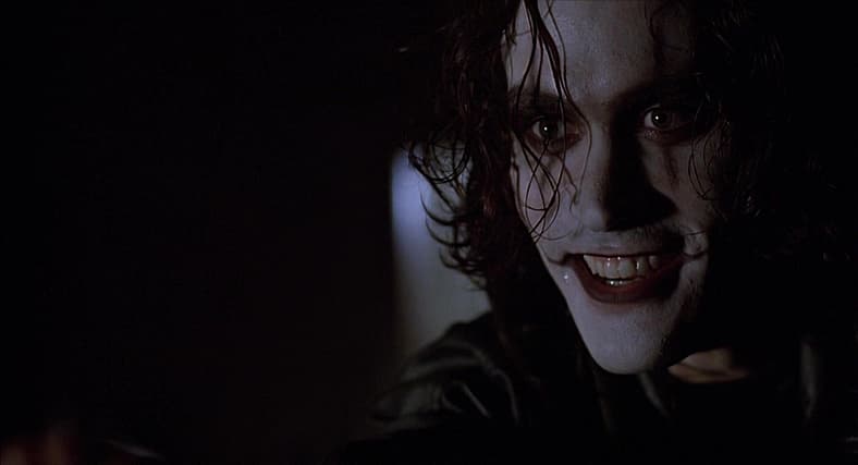 Eric Draven (Brandon Lee) tells Funboy (Michael Masse) to say his prayers in The Crow (1994)