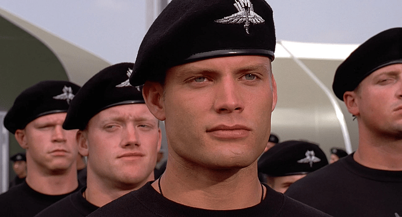 Johnny (Casper Van Dien) reports for morning inspection in Starship Troopers (1997), Tri-Star