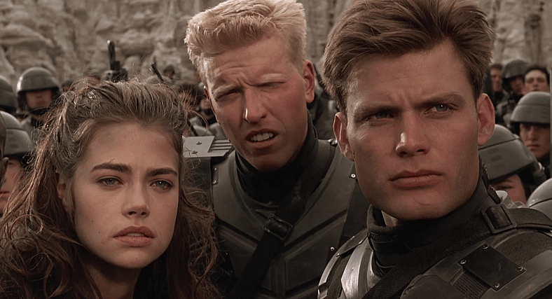 Carmen, Ace, and Johnny emerge from a Bug den in Starship Troopers (1997), Tri-Star Pictures