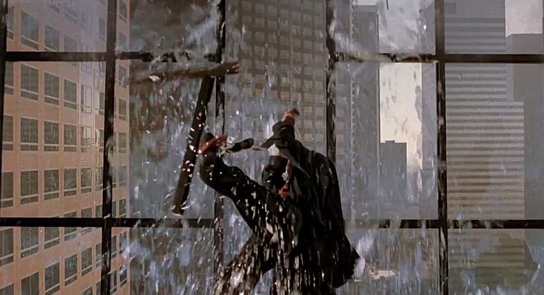 Peyton (Liam Neeson) crashes a board meeting in Darkman (1990), Universal Pictures