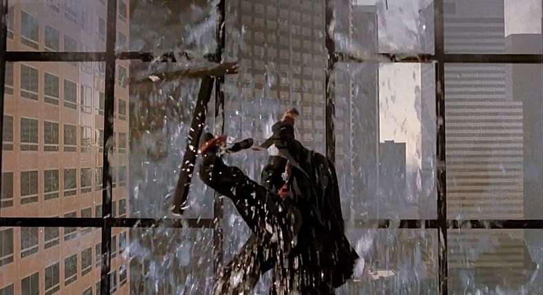 Peyton (Liam Neeson) crashes a board meeting in Darkman (1990), Universal Pictures