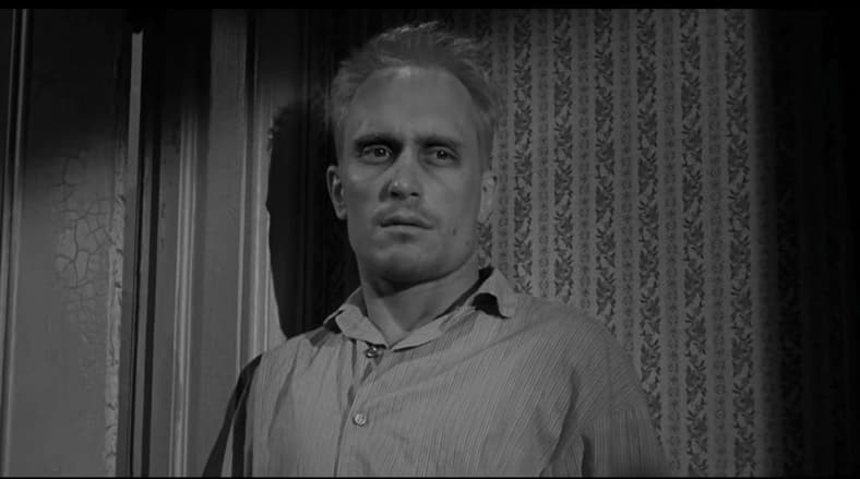 The gentle Arthur "Boo" Radley (Robert Duvall) has serious "Resting Axe-Murder Face" in To Kill A Mockingbird (1962), Universal-International Pictures