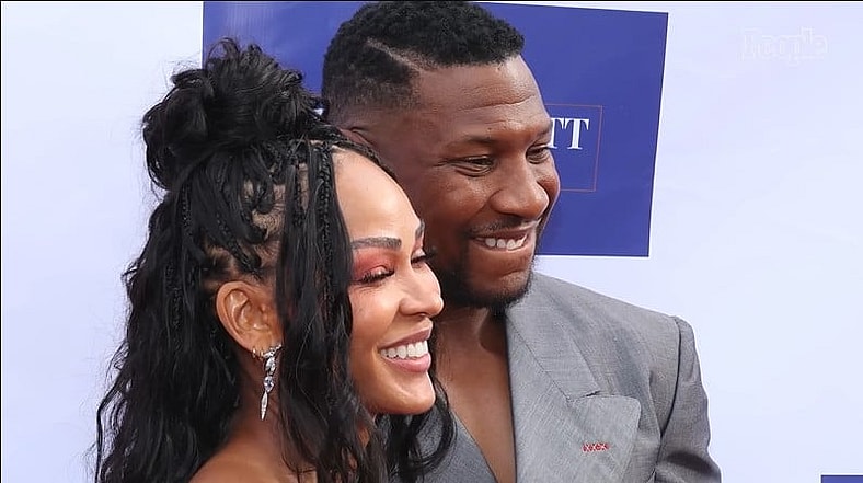 Meagan Good and Jonathan Majors pictured smiling in a photo gallery by People Magazine, July 10, 2024 via YouTube