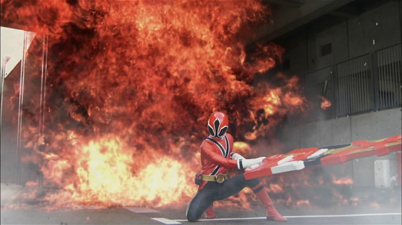 Takeru Shiba (Tori Matsuzaka) lets loose his Rekka Daizantou as Shinken Red in Samurai Sentai Shinkenger Episode 1 "Act 1: The Gallant Appearance of the Five Samurai" (2009), Toei Co. Ltd.