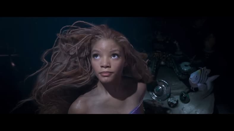 Ariel (Halle Bailey) longs for the surface in The Little Mermaid (2023), Disney
