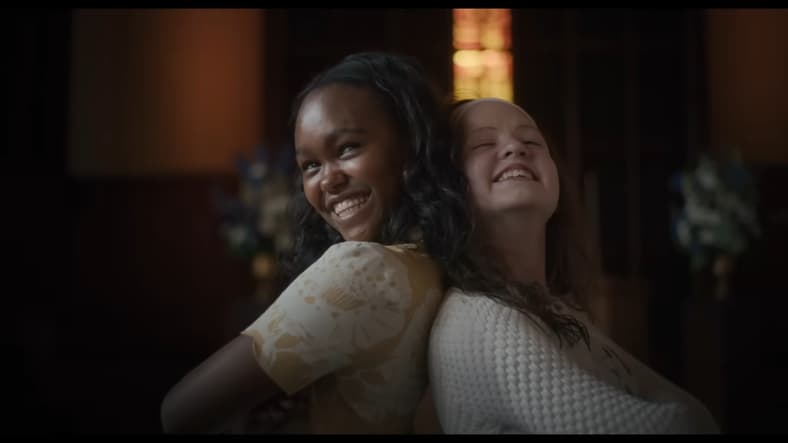 Katherine (Olivia O'Neill) and Angela (Lidya Jewett) pose for a photo in The Exorcist: Believer