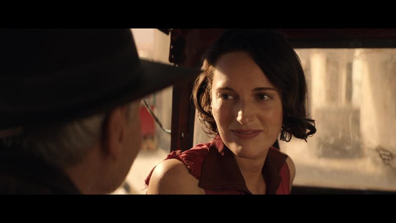 Helena (Phoebe Waller-Bridge) dismisses Indy's (Harrison Ford) adventuring advice in Indiana Jones and the Dial of Destiny (2023), Lucasfilm