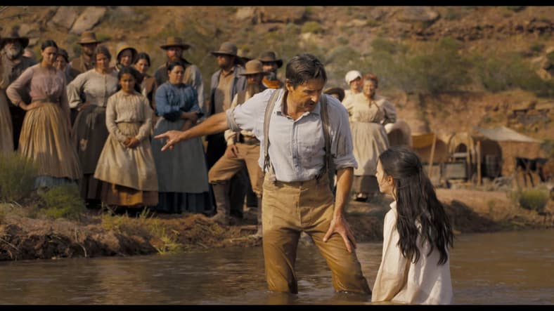 A settler (Luke Wilson) attempts to show one of his followers the light of God in Horizon: An American Saga (2024), New Line Cinema