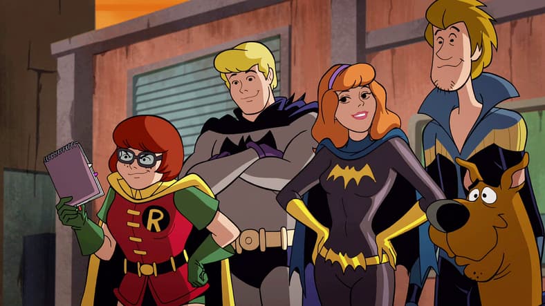 Robin (Kate Micucci), Batman (Frank Welker), Batgirl (Grey Griffin), Nightwing (Matthew Lillard) and Batman (Frank Welker) reveal their true identities in Scooby-Doo! & Batman: The Brave and the Bold (2018), Warner Bros. Animation