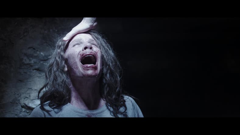 Ed Warren performs emergency exorcism, The Conjuring (2013), New Line Cinema