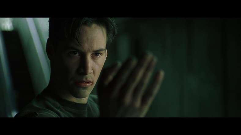 Neo (Keanu Reeves) goads on Agent Smith (Hugo Weaving) in The Matrix (1999), Warner Bros. Pictures