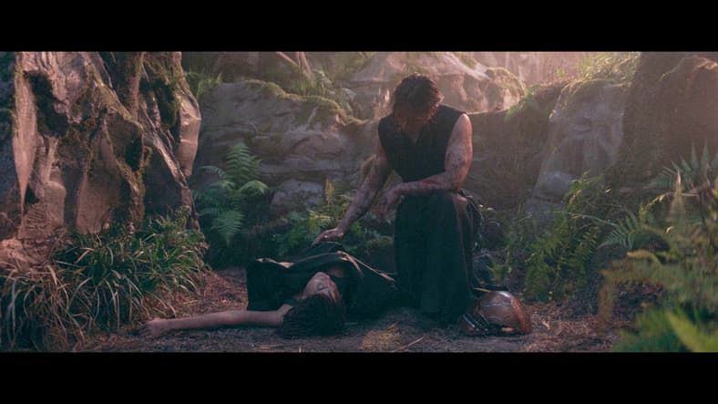 The Stranger watches over wounded Osha in The Acolyte Season 1 Episode 5 "Night" (2024), Disney
