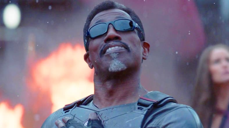 Blade (Wesley Snipes) watches on as the titular duo (Ryan Reynolds, Hugh Jackman) escape from The Void in Deadpool & Wolverine (2024), Marvel Entertainment