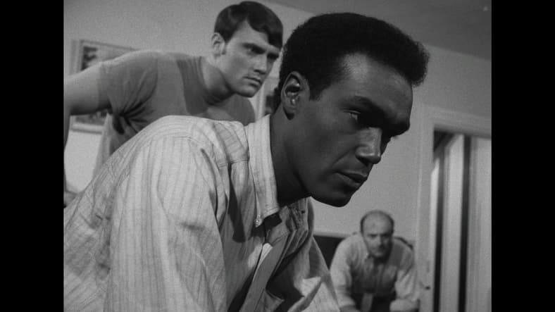 Ben, Tom, and Harry tune in to news in Night of the Living Dead (1968), Continental Distributing