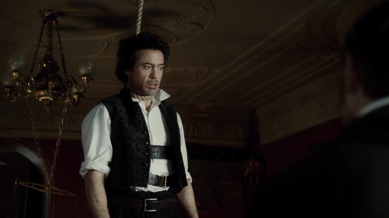 Holmes (Robert Downey Jr.) attempts to deduce the circumstances behind a recent hanging in Sherlock Holmes (2009), Warner Bros. Pictures